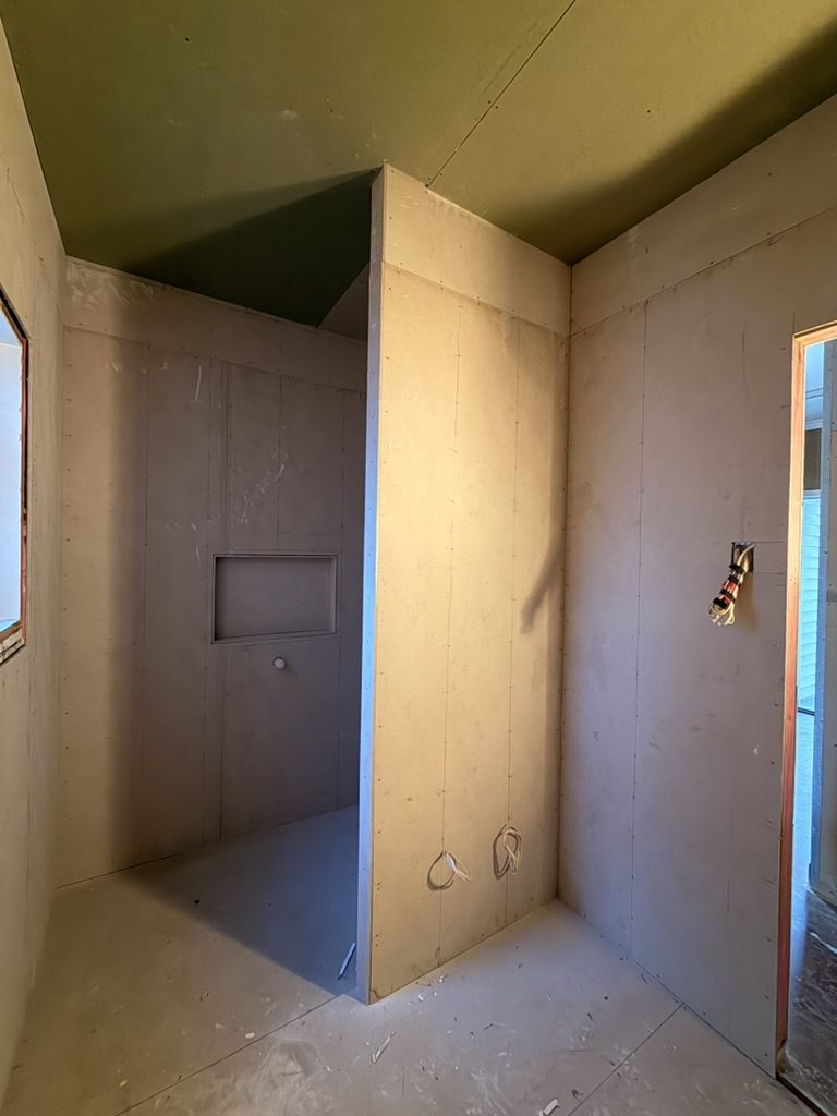 New main bathroom reframed with tiled niche