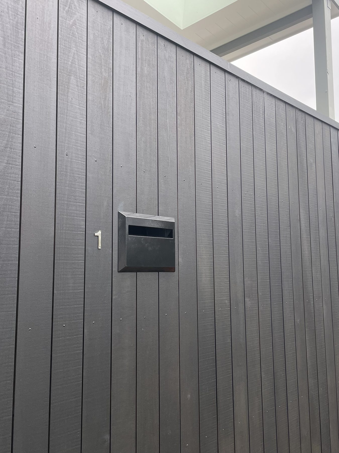 Finished fence with built-in letterbox and house number