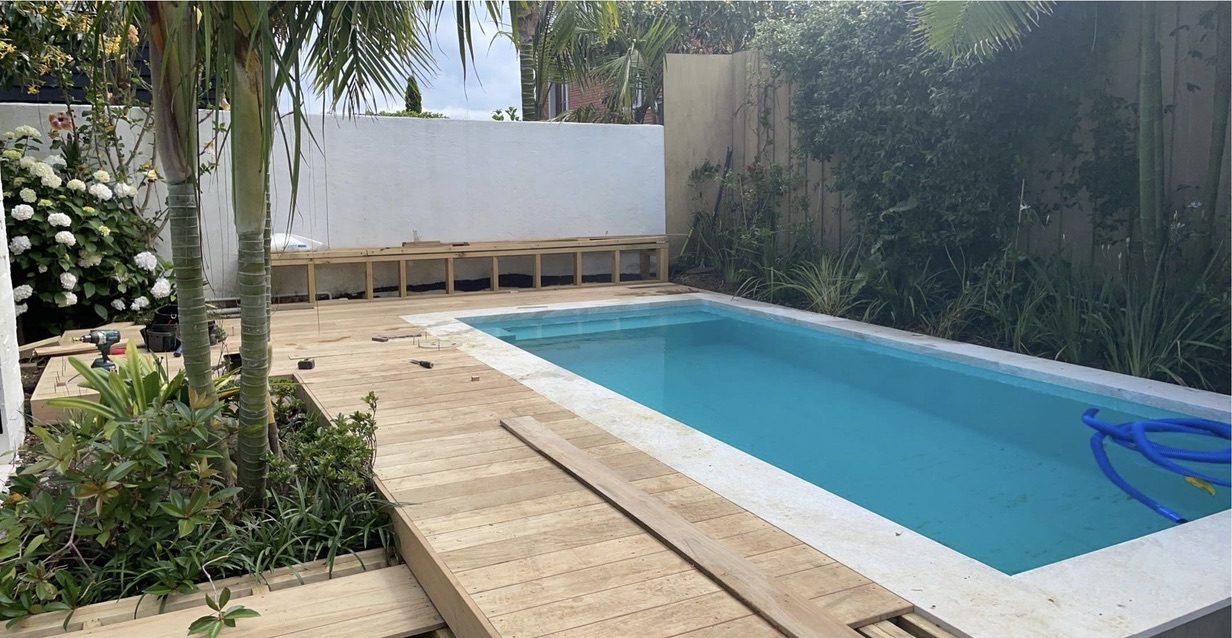 Timber deck being laid around a new pool